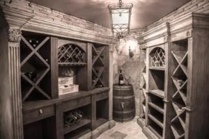 Rustic wood wine cellar with X-pattern cabinet doors, wine barrel, and decorative pendant light